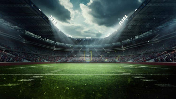 Dynamic Stadium Scene. Large, modern stadium filled with enthusiastic fans, green football field under dramatic sky, lit by stadium lights. 3D render
