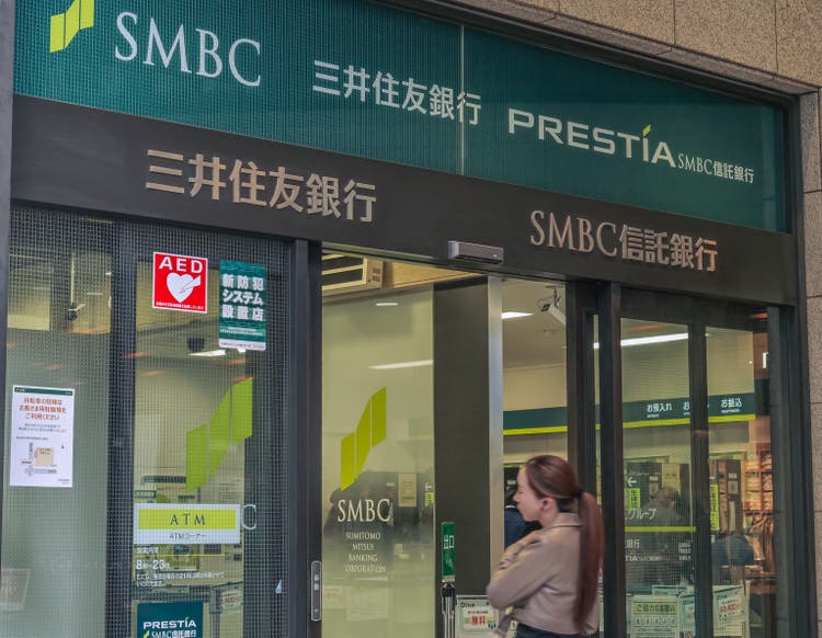 Customer entering the branch office of SMBC bank in Kyoto, Japan.