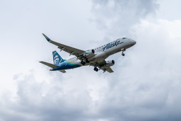 Alaska Airlines / SkyWest Airlines Embraer ERJ landing at the airport.
