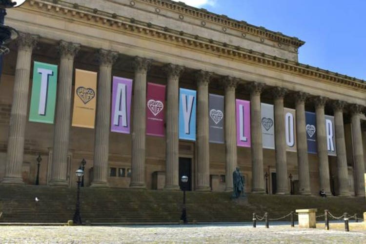 Banners in Liverpool advertising Taylor Swift"s 2024 "The Eras Tour" at Anfield