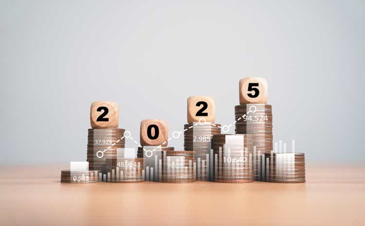 Year 2025 on top of coin stack for new year financial plan includes budget tax investment saving concept.