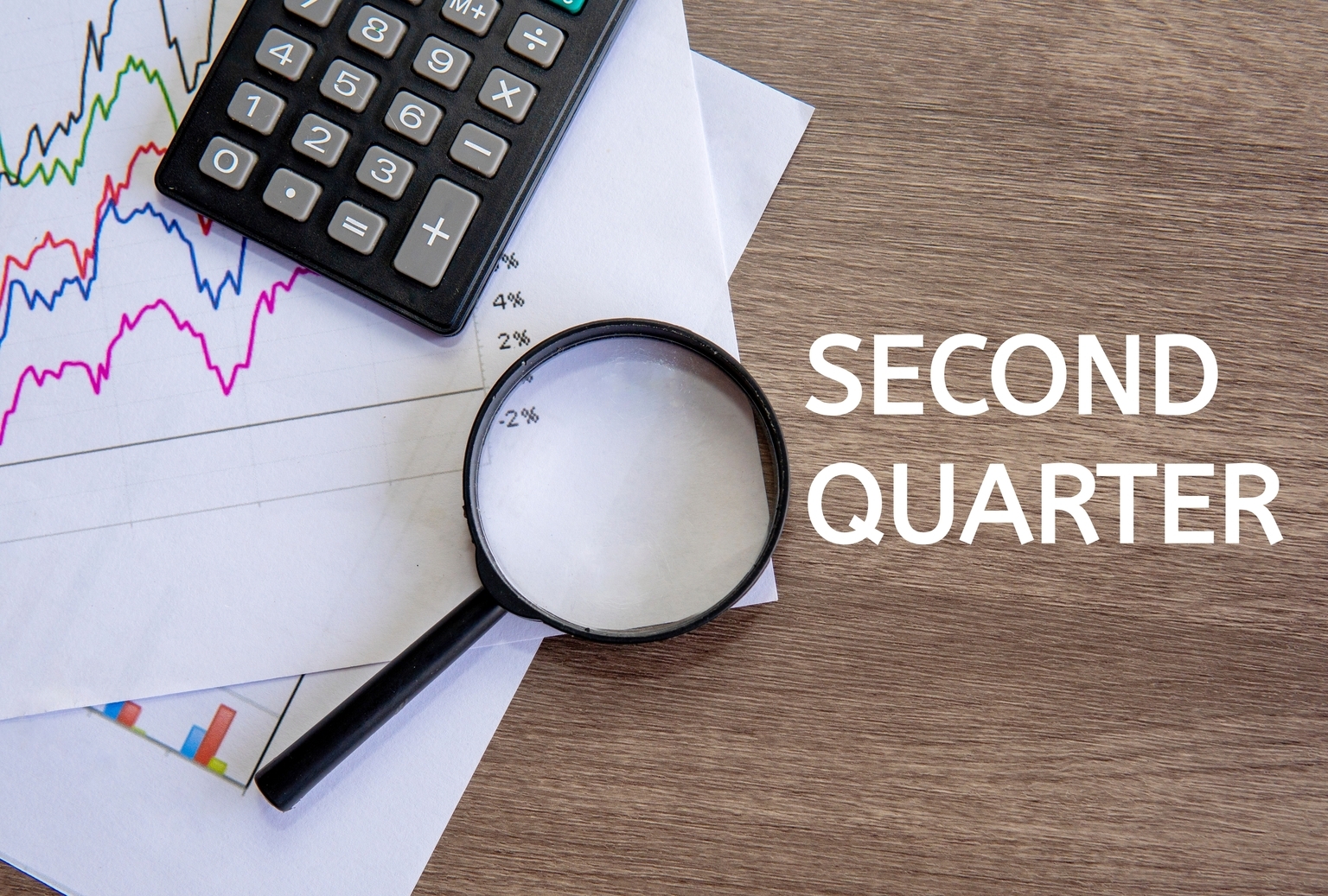 Top view image of text SECOND QUARTER on office desk.
