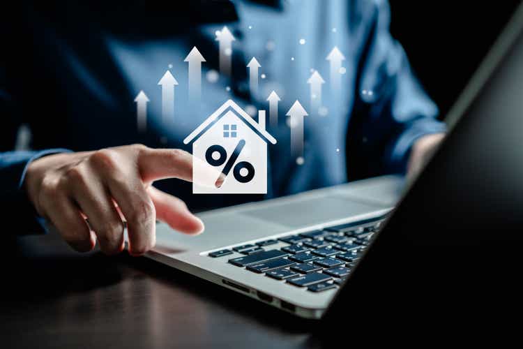 Interest rate and mortgage loan concept, Businesswoman analyze interests rate house increase trend follow up economic growth and inflation, Macroeconomics, real estate, income, marketing and profit.