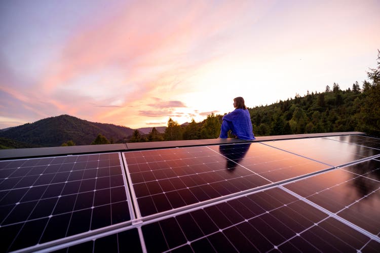 Rooftop with solar panels on house in mountains,