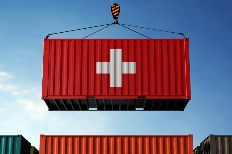 Switzerland trade cargo container hanging against clouds background