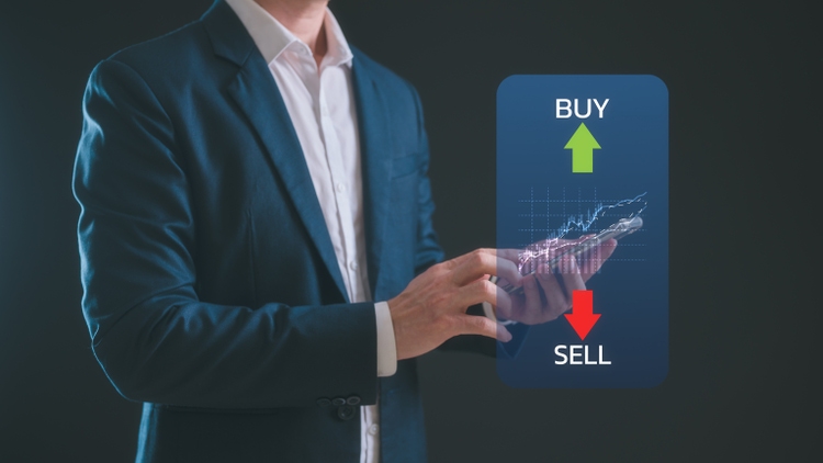 Stock market or forex trading graph and candlestick chart suitable for financial investment concept, businessman using smartphone and computer working with stock market data chart buy and sell