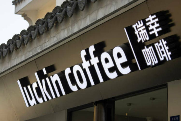 Luckin Coffee logo and the shop in Suzhou, China