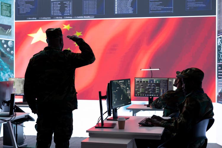 Military officer in uniform monitors critical data on big screen