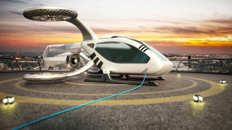 White Futuristic eVTOL Charging on Rooftop Landing Pad at Sunset