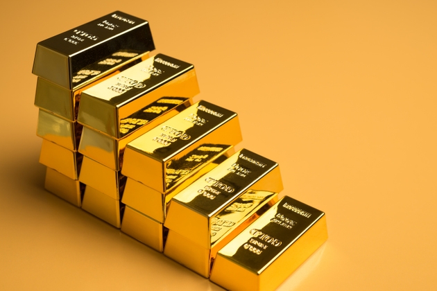 Stack gold bars as falling down stairs on yellow background.