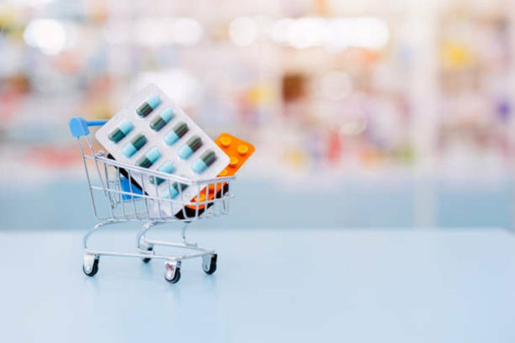 Medicine pack set in shopping cart for medicine buying market consumer products retail in pharmacy drugstore with copy space for advertising.