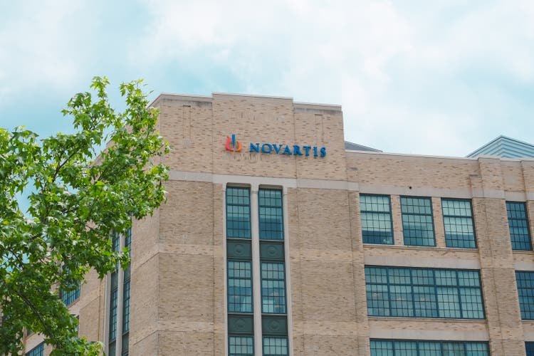 View of Novartis innovative medicines company office building with logo sign, pharmaceutical corporation