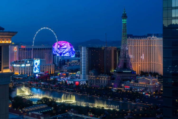 The Sphere and full replica of the Eiffel Tower in Las Vegas in twilight