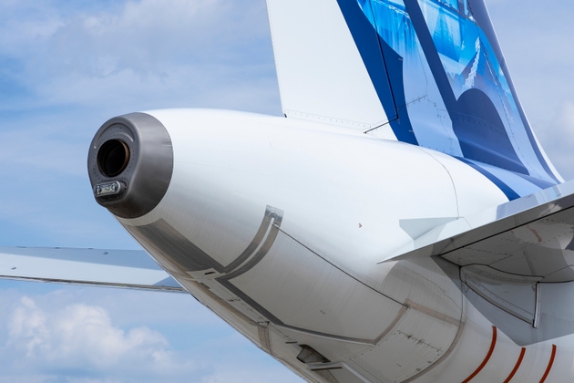 APU exhaust and tail of an airplane. Airbus A321neo XLR fuselage end.