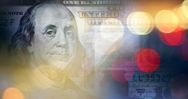 American one hundred dollar bill in glowing lights