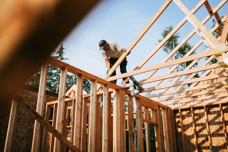 Construction Crew Putting Up Framing of New Home