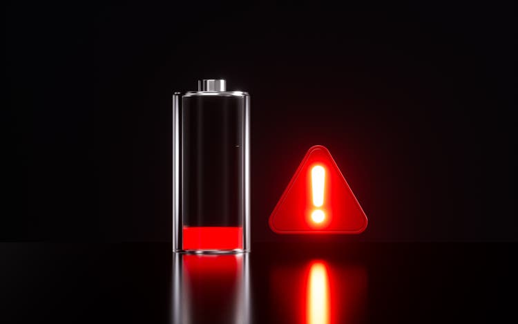 Batteries and warning signs, low battery warning, 3d rendering.
