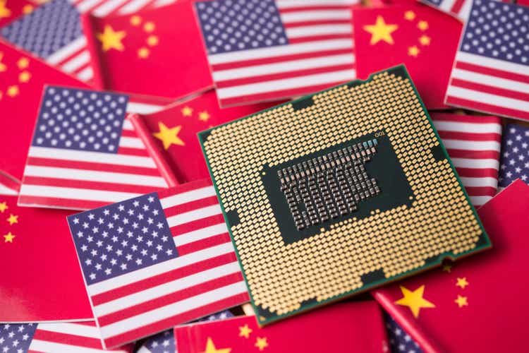 CPU computer (central processing unit) on Chinese and USA flag background.