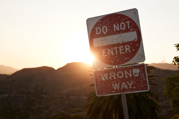 No entry sign board at sunset