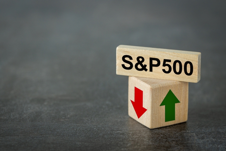 S and P 500 index symbol. Wooden blocks with an arrow that symbolizes that the S and P 500 index is changing trend, goes up or down. Business concept. Copy space.