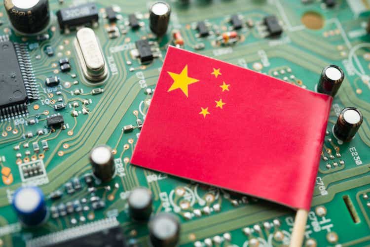 Chinese flag on CPU computer (central processing unit) background.