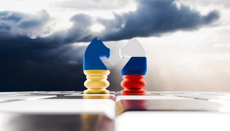 Face off of two rooks in Ukraine and Russian flag colors with moody sky