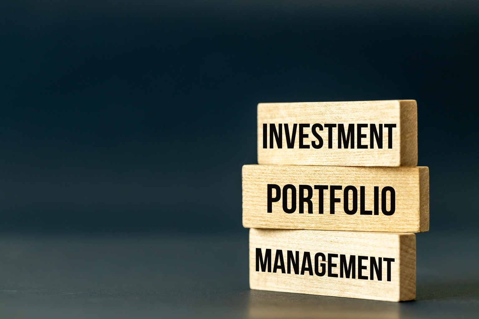 Investment Portfolio Management symbol. Business concept, Slogan on wooden blocks, words investment portfolio management, copy space