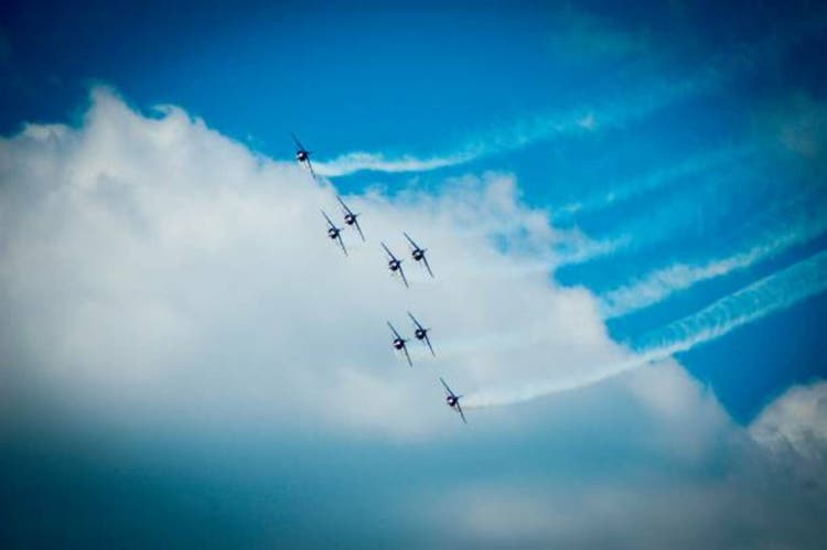Low Angle View Of Airshow In Cloudy Sky