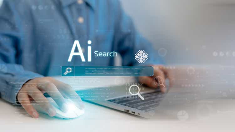 Ai search tech concept, Person use laptop with AI search engine bar for data search optimization by artificial intelligence technology.