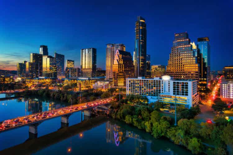 Austin Skyline At Dusk With Brilliant Sunset Reflections And Lake