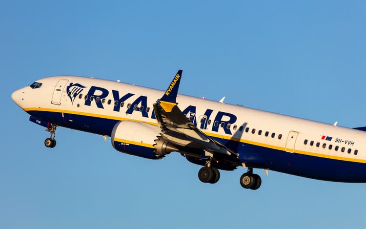 Ryanair aeroplane Boeing 737MAX taking off in beautiful evening light