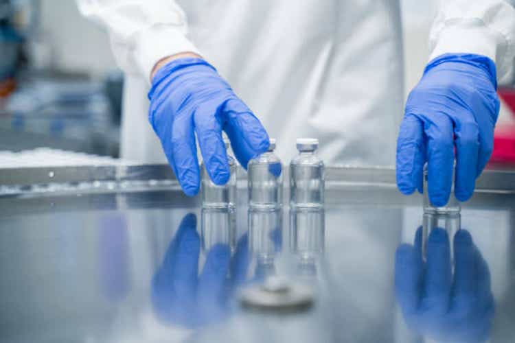 Detail of hands working in pharmaceutical factory