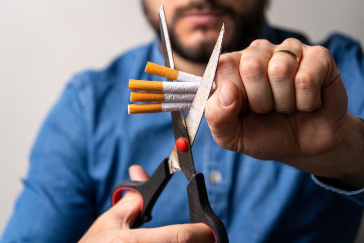 Stop smoking. Person trying to quit smoking.