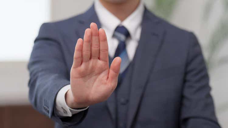 Hands of a businessman showing his palm
