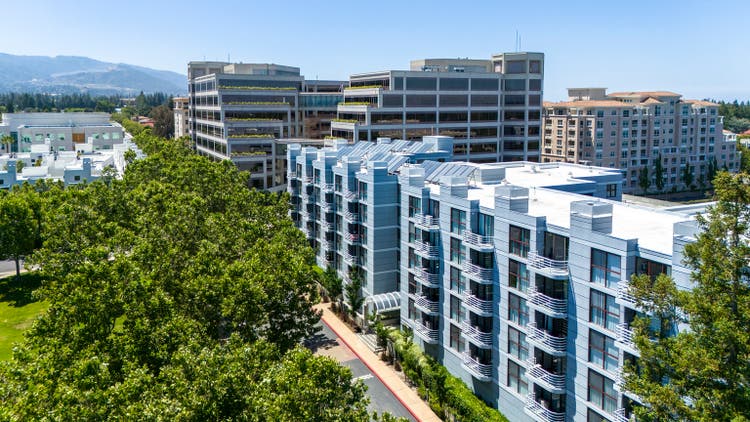Urban development in Cupertino, CA. Modern residential and office buildings reshape Silicon Valley skyline.