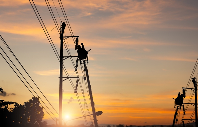 Electrician working on power lines