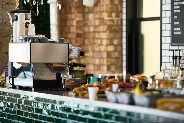 Cafe counter with coffee machine and food