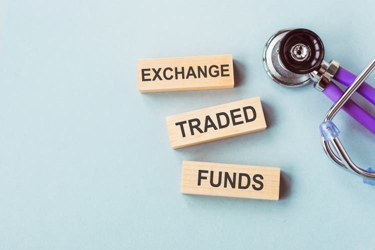 ETF text on wooden blocks with stethoscope. Concept for healthcare etf