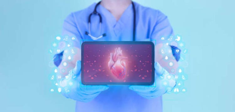 Doctor analyzes heart through his tablet. Cardiology and healthcare concept for heart problems. Digital medicine, modern digital health.