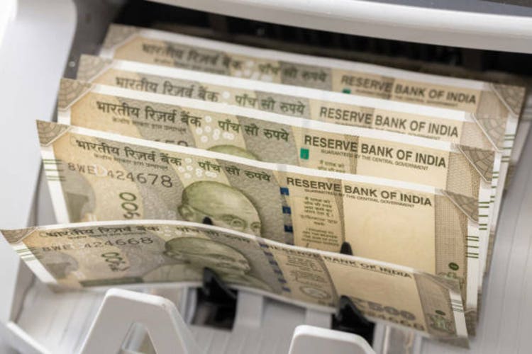 India money. Indian rupees in converter machine. Financial business concept, close up