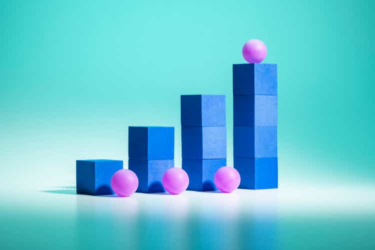 Bar graph growth concept / Blue blocks purple balls