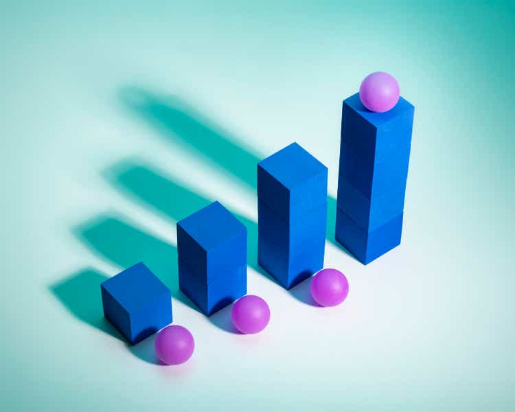 Bar graph growth concept / Blue blocks purple balls