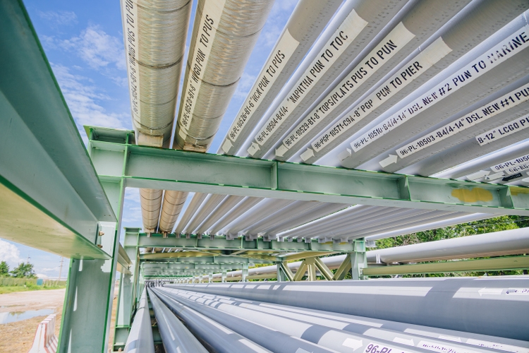 Oil refinery gas pipe. Large diameter pipelines transport oil products to and from refinery plant.