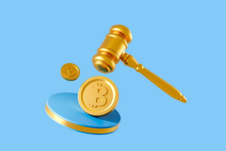 Golden gavel and Bitcoin coins on a blue background. 3D Rendering
