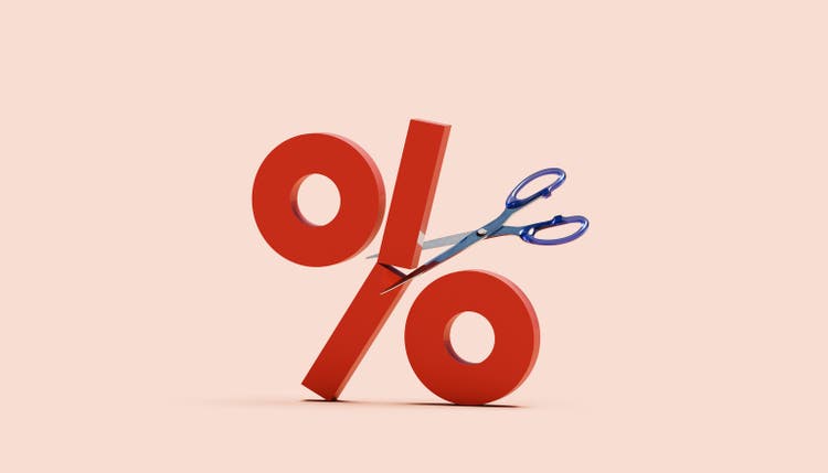 Percentage sign cut in half by scissors