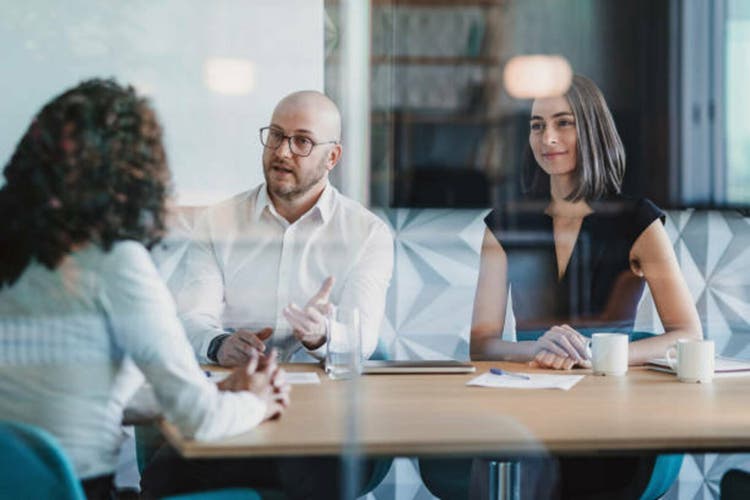 Business persons discussing financial plan