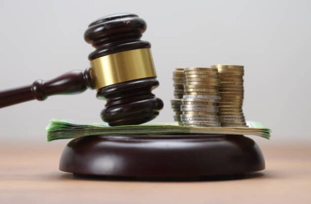 Gavel with Euro Banknotes and Coins – Symbols of Financial and Legal Matters