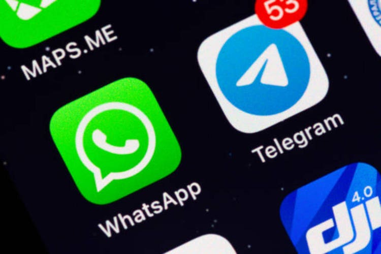 Two most popular in the world messengers WhatsApp and Telegram app icons on display of an iPhone