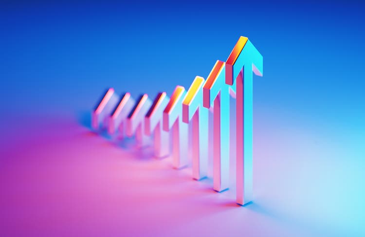 Metallic Arrow Symbols Which Are Illuminated By Blue And Magenta Lights Forming A Graph On Blue And Magenta Background