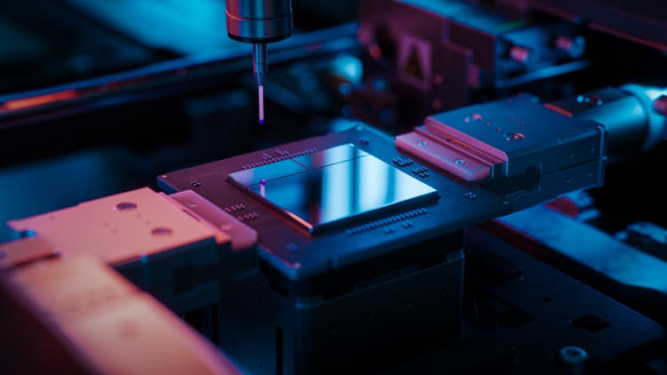 Close-up Microchip on Conveyor Line during Production and Packaging Process on Semiconductor Fab. Advanced Computer Chip illuminated with Red Light in Industrial Environment.